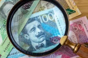 peru,money,and,magnifying,glass,,finance,and,economic,concept,,close
